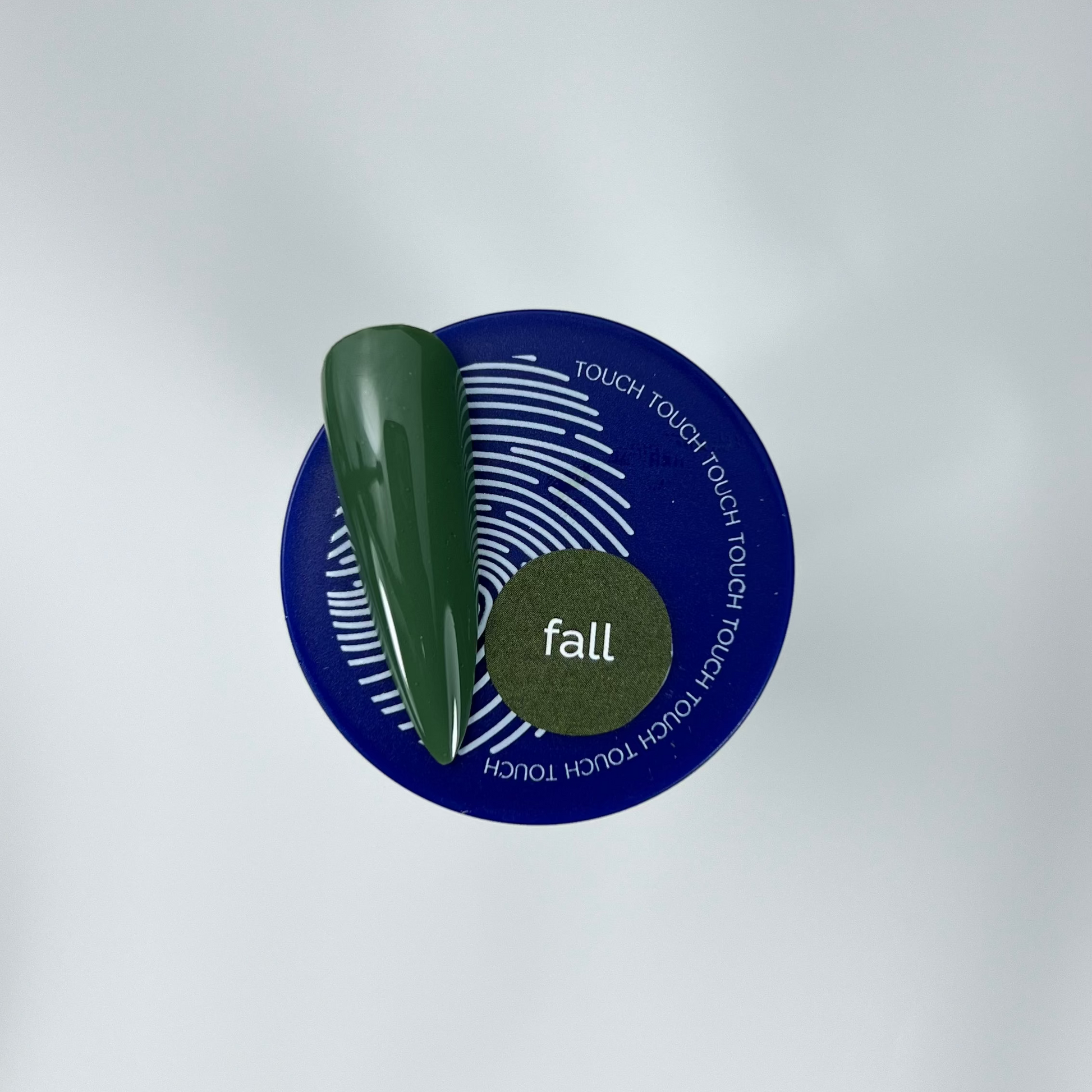 Touch green colour nail swatch and blue jar