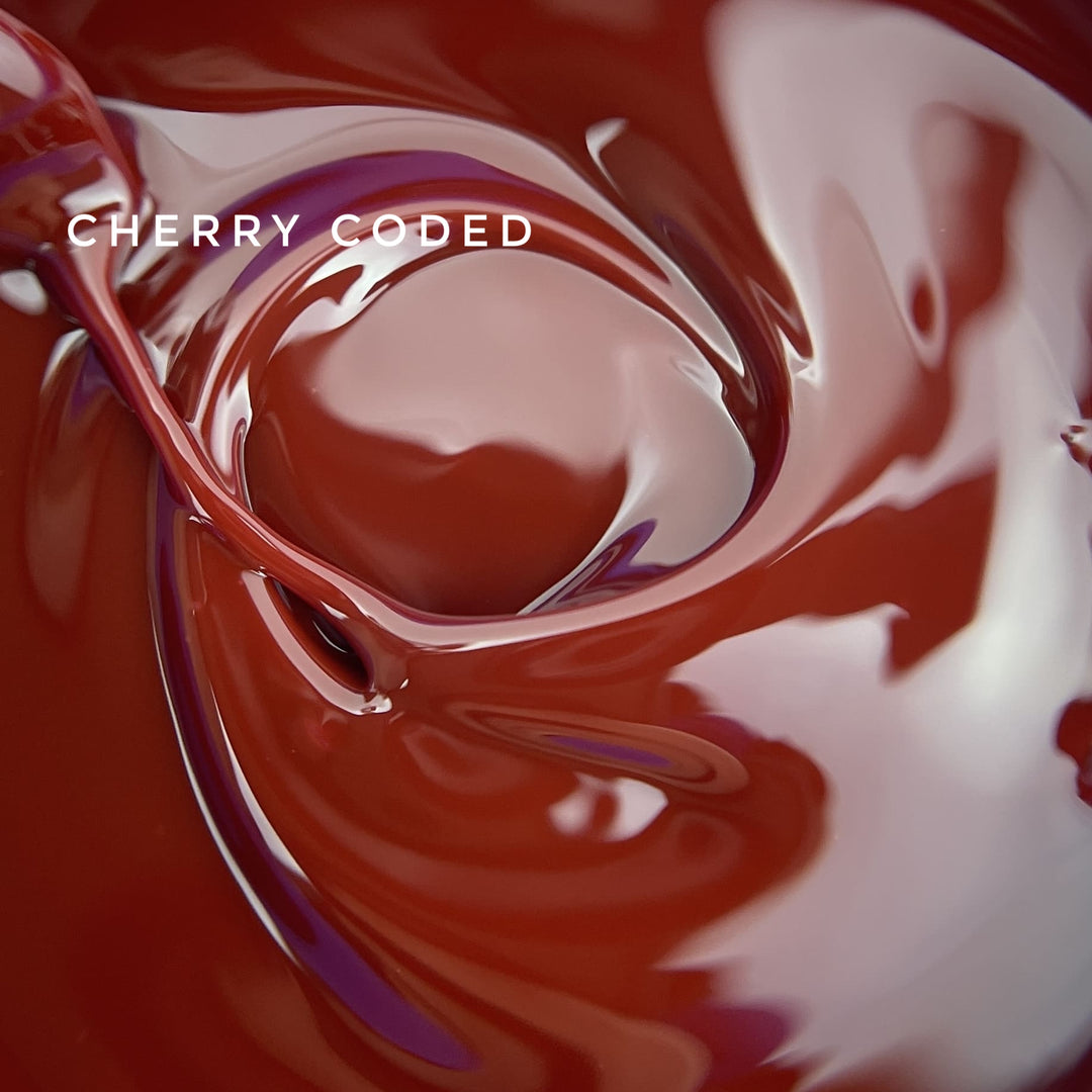 Close-up of swirling red and white liquid with 'Cherry Coded' text.